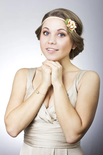 Beautiful lovely girl with a flower on her head — Stock Photo, Image