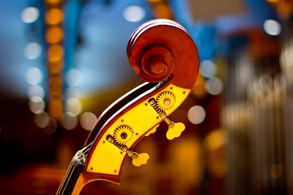 Contrabass on stage in front of an empty hall — Stock Photo, Image