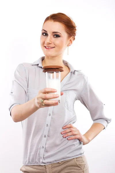 Young girl with a round chocolate chip cookies on a white background. Portrait of a slim girl. Healthy breakfast. chocolate chip cookies — Stock Photo, Image