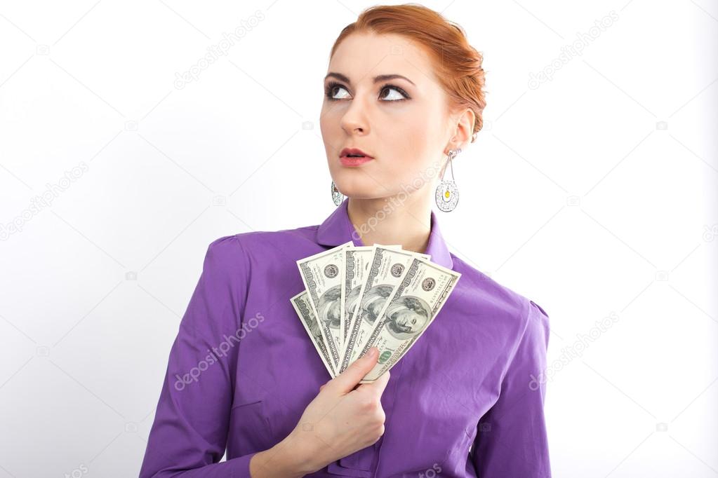 Young girl with bright hundred dollar bills in her  hands. Business woman. bank employee
