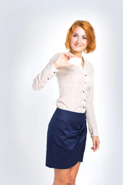 Young beautiful business woman with white business card in hand. Office worker. Office Style — Stock Photo, Image