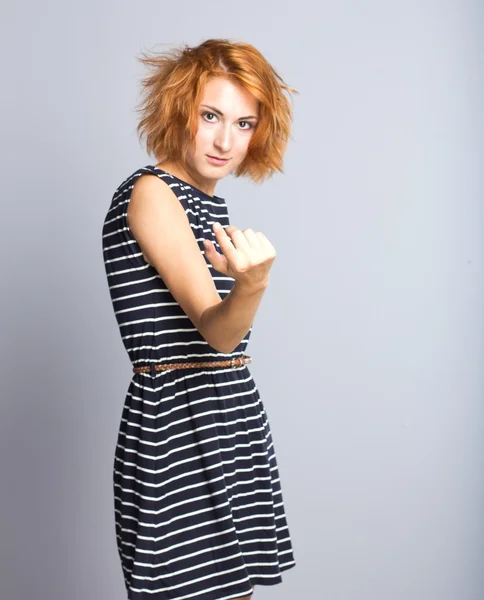 Beautiful girl takes care of the short red hair. Portrait of a young girl.Woman hair style fashion portrait — Stock Photo, Image