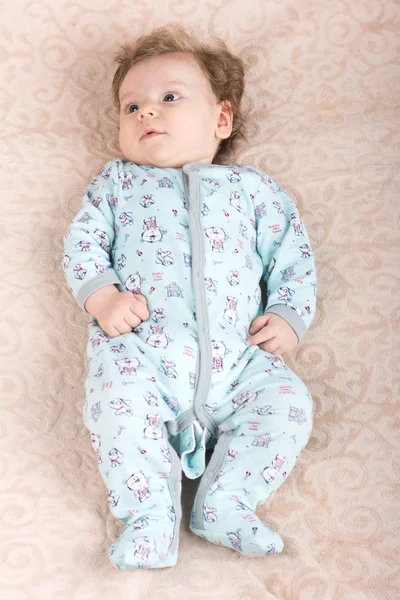 Beautiful baby with a lovely toys.The child in the crib — Stock Photo, Image