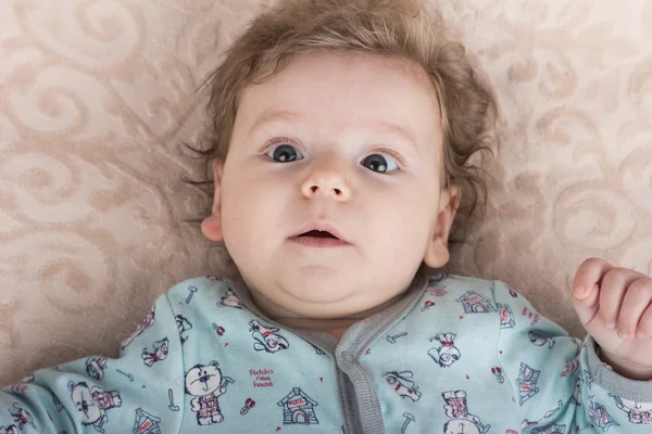 Beautiful baby with a lovely toys.The child in the crib — Stock Photo, Image