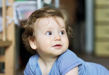 Funny baby playing with toys at home. Little smiling boy. Portrait-year-old child