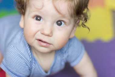 Funny baby playing with toys at home. Little smiling boy. Portrait-year-old child