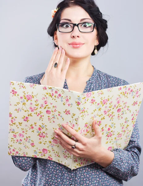 Young student with a folder in his hands. Romantic style. Provence. Beautiful girl in glasses — Stock Photo, Image