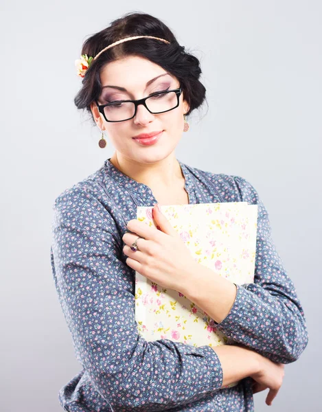 Young student with a folder in his hands. Romantic style. Provence. Beautiful girl in glasses — Stock Photo, Image