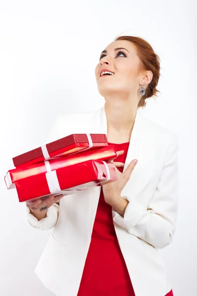 Young girl in red dress with gift red box. Beautiful red-haired girl on white. — Stock Photo, Image