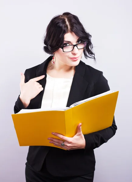 Young attractive teacher in glasses.Portrait of a teacher in a stylish jacket. Portrait of a beautiful girl — Stock Photo, Image