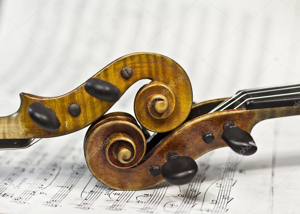 beautiful violin on a background of the old notes. musical instruments. stringed instruments