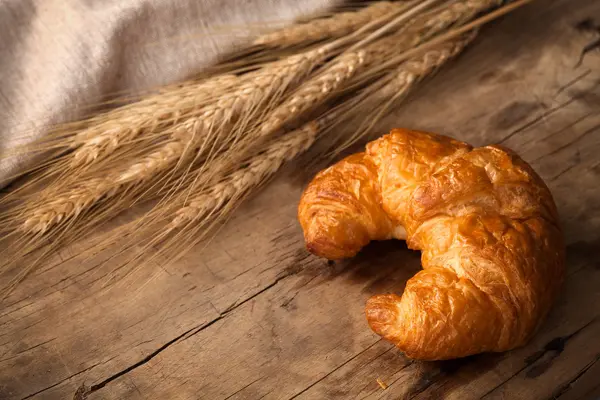 Tasty croissant still life rustic wooden background — Stock Photo, Image