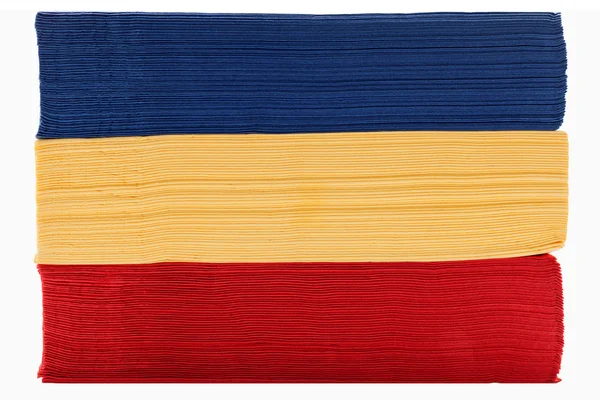 Stack of red yellow and blue napkins — Stock Photo, Image