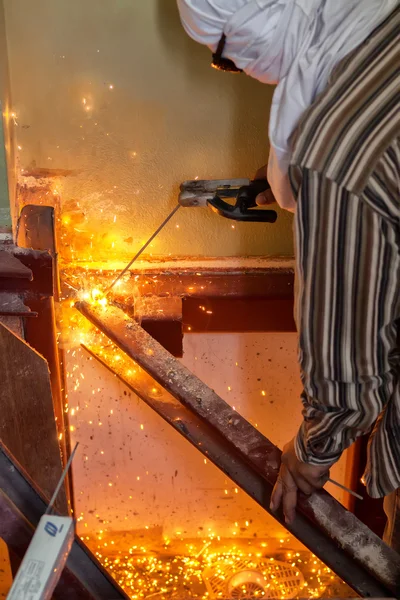 Welding steel with spread spark lighting smoke — Stock Photo, Image