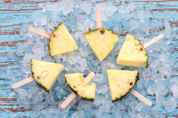 Pineapple popsicle yummy fresh summer fruit sweet dessert wood teak — Stockfoto