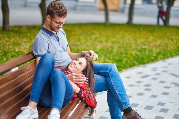 Lovely Portrait Young Couple Sitting Bench Embracing Kissing — Stock Photo, Image