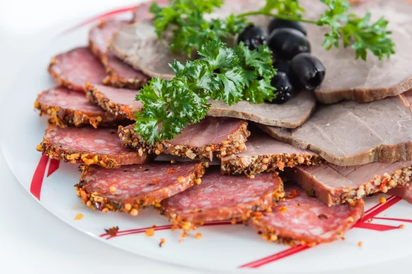 Smoked pork with olives and herbs — Stock Photo, Image