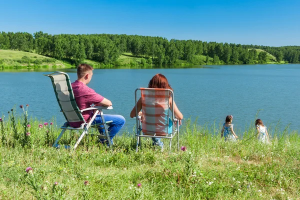 Outdoor portrait of happy semei near the lake — Stock Photo, Image