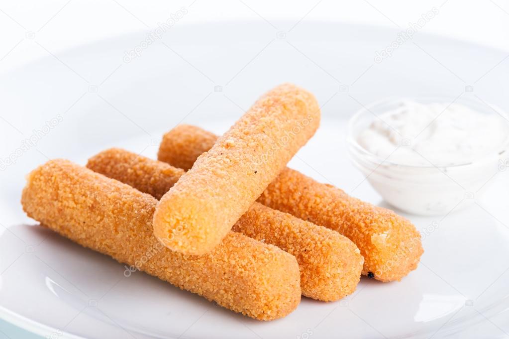 Crispy cheese sticks deep-fried on a white background