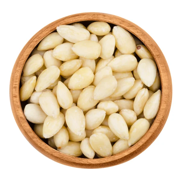 Blanched almonds in a bowl on white background — Stock Photo, Image