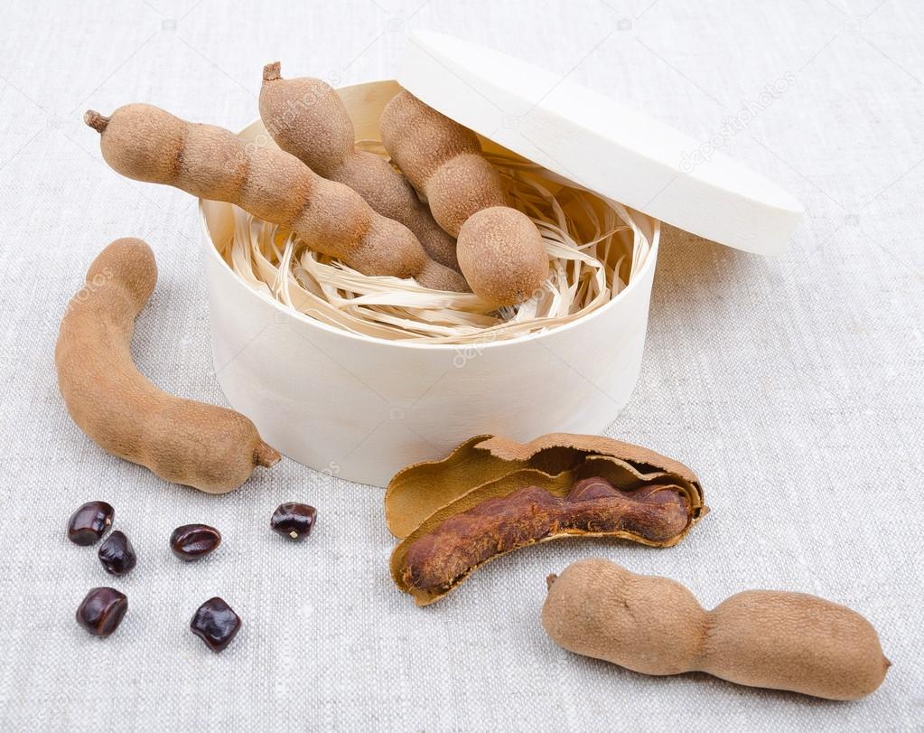 Dried Tamarind Fruits With Seeds In A Box On Linen