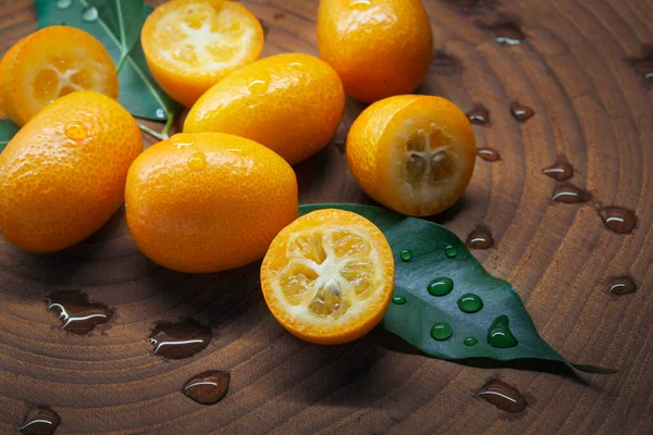 Healthy Eating Concept Bunch Delicious Wet Fresh Kumquats Wooden Background — Stock Photo, Image