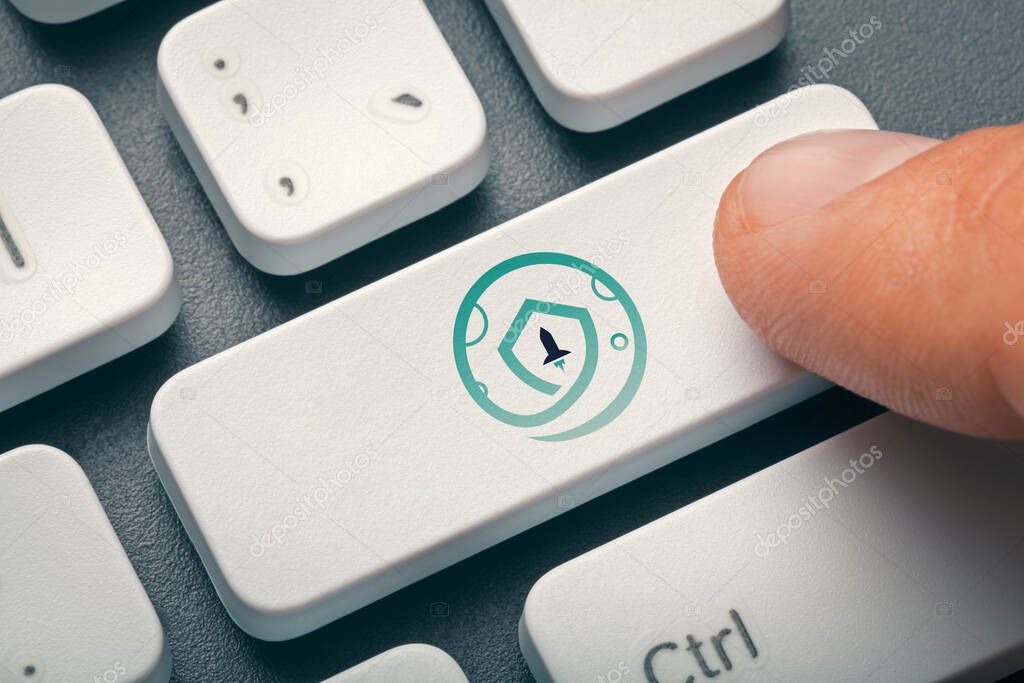 Cryptocurrency trading or exchange concept: Index finger pressing computer key with safemoon token logo. 