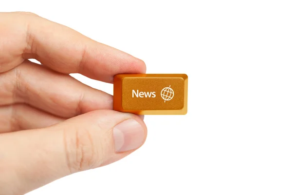 Hand holding news computer key — Stock Photo, Image