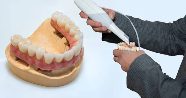 Prosthetic dentistry. Production of removable dentures. A dental technician makes dentures. Dental equipment. Elimination of dental problems.