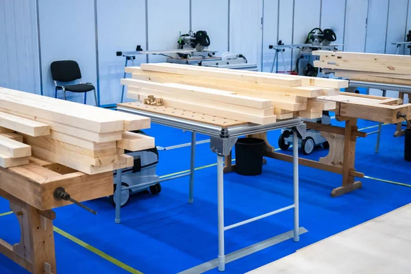 Woodworking workshop. Wood processing workshop. Several installations with timber beams. The concept is an empty furniture workshop. Furniture workroom. Processing of wood beams.