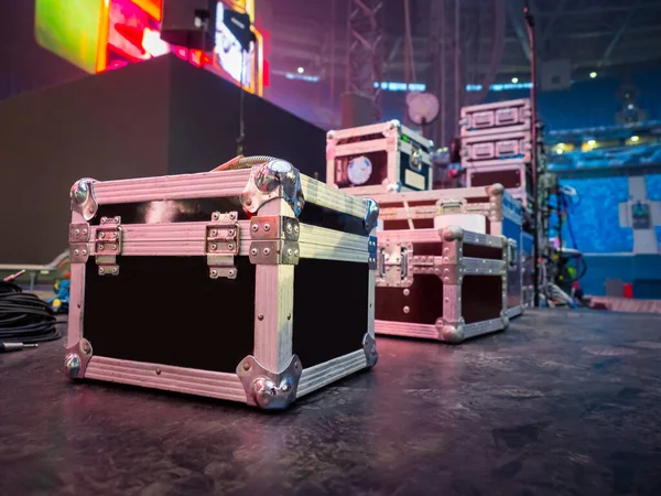 Preparation for concert concept. Cases for musical equipment on stage. Sound equipment transport boxes. Concept - rental of sound equipment. Rent and sale of musical instruments. Concert facilities