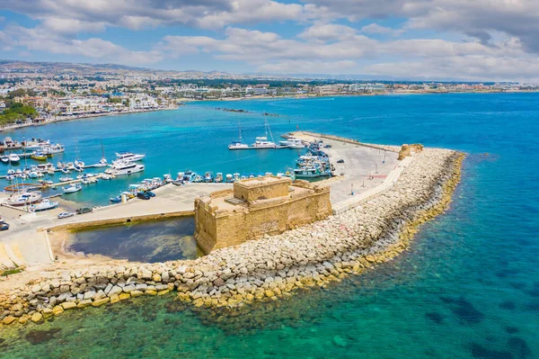 Ancient castle in cyprus. Antique fort off coast of paphos. Medieval port castle in harbor. Attractions of the city of Paphos. Bird eye view of harbor in Cyprus. Paphos museums. Travel Cyprus