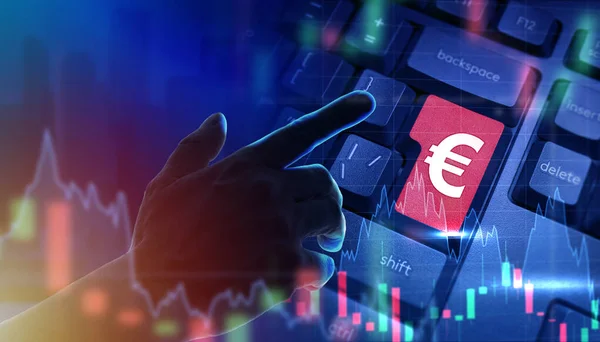 Investment in Euro. Buying and selling European Union currency. Trader hand on keyboard background with a red button. Investment charts near trader hand. European Union Investment Banner.