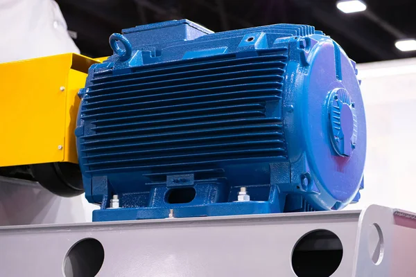 Blue high voltage electric motor. Blue electric engine close-up. Production electric motor. The motor for generating electricity in enterprise. Electricity generation in production.