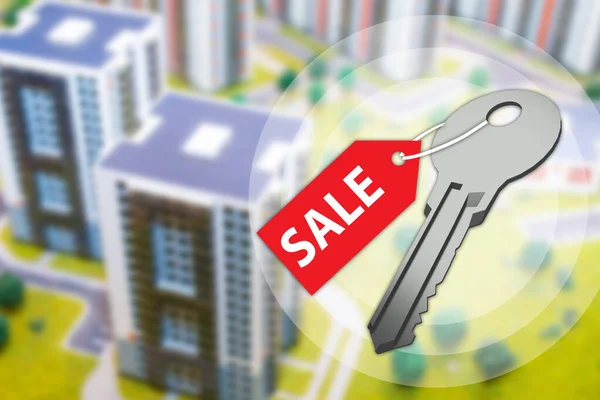 Buying a property. Key with sale tag. Blurred city in background. Purchase of real estate. Banner about buying and selling real estate. Key to apartment with the inscription sale. 3d visualization