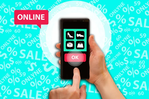 Online shopping in app. Online shopping. Simple store app interface. Mobile app interface on turquoise background. Buying and selling goods in apps. Online shopping via phone. Smartphone in hands