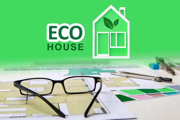 Eco house logo on a green background. Eco house inscription near construction drawings. Architectural drawings environmentally friendly house. Concept building from environmentally friendly materials