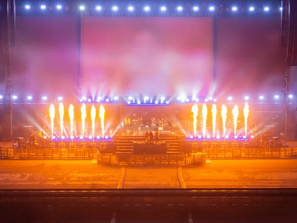 Stadium or concert hall scene. Equipment is being checked on concert stage. Concept - preparation for concert. Preparing for performance. Preparatory work before someone\'s performance.