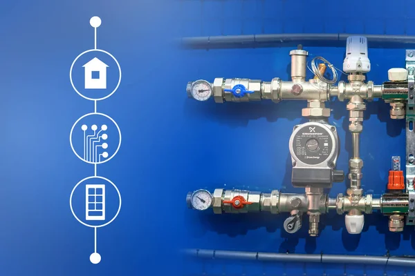 Water supply and heating in the house. A fragment of a home water pipe. Accounting for water consumption. Pipes, adapters, valves, and measuring instruments. A fragment of a water pipe near the labels