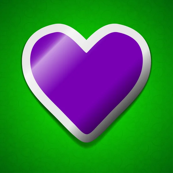 Signo del corazón. Símbolo chic etiqueta pegajosa de color sobre fondo verde . — Foto de Stock