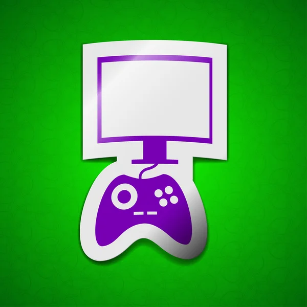 Joystick és a monitor ikon jele. Szimbólum elegáns színes öntapadó címke zöld háttér. — Stock Fotó