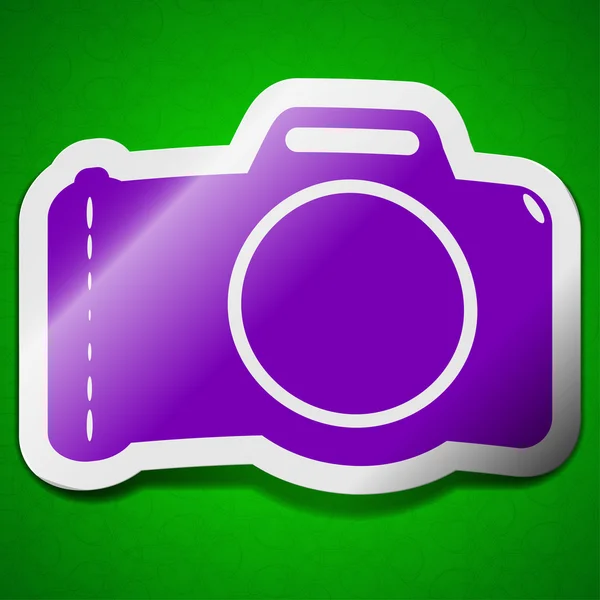 Photo camera icon sign. Symbol chic colored sticky label on green background. — Stock Photo, Image