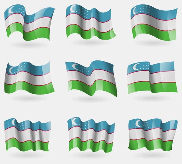 Set of Uzbekistan flags in the air. Vector — Stock Vector