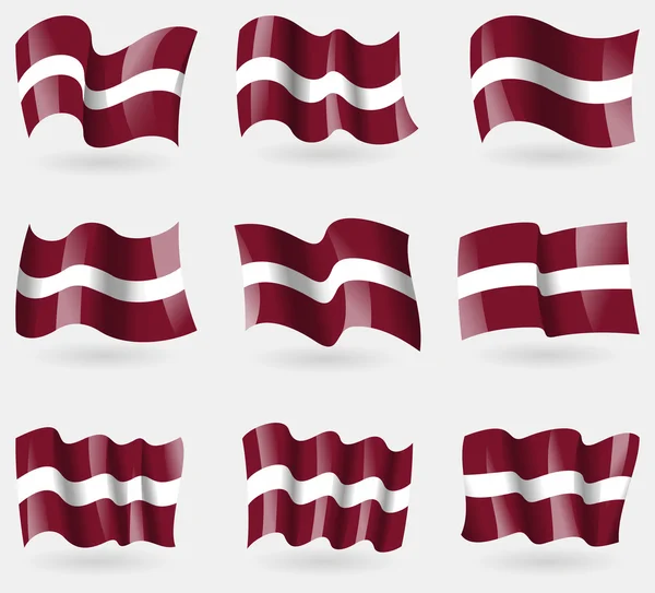 Set of Latvia flags in the air. Vector — Stock Vector