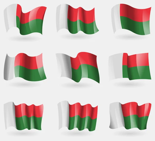 Ensemble de drapeaux de Madagascar dans les airs. Vecteur — Image vectorielle