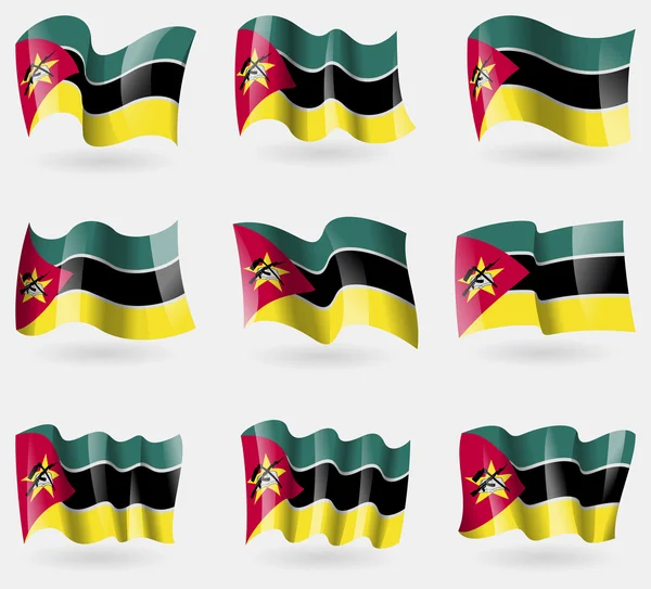 Ensemble de drapeaux du Mozambique dans les airs. Vecteur — Image vectorielle