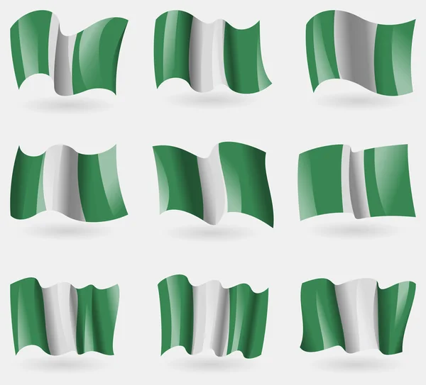 Set of Nigeria flags in the air. Vector — Stock Vector