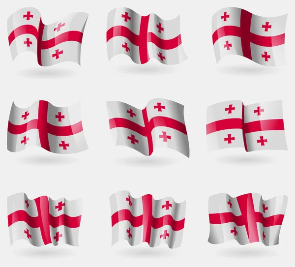 Set of Georgia flags in the air. Vector — Stock Vector