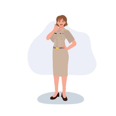 Taylandlı bir kadın devlet memuru ya da resmi üniformalı bir memur, gülümsüyor ve baş parmak işareti yapıyor.