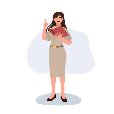 Devlet memuru kadın öğretmen elinde ders kitabı tutuyor.